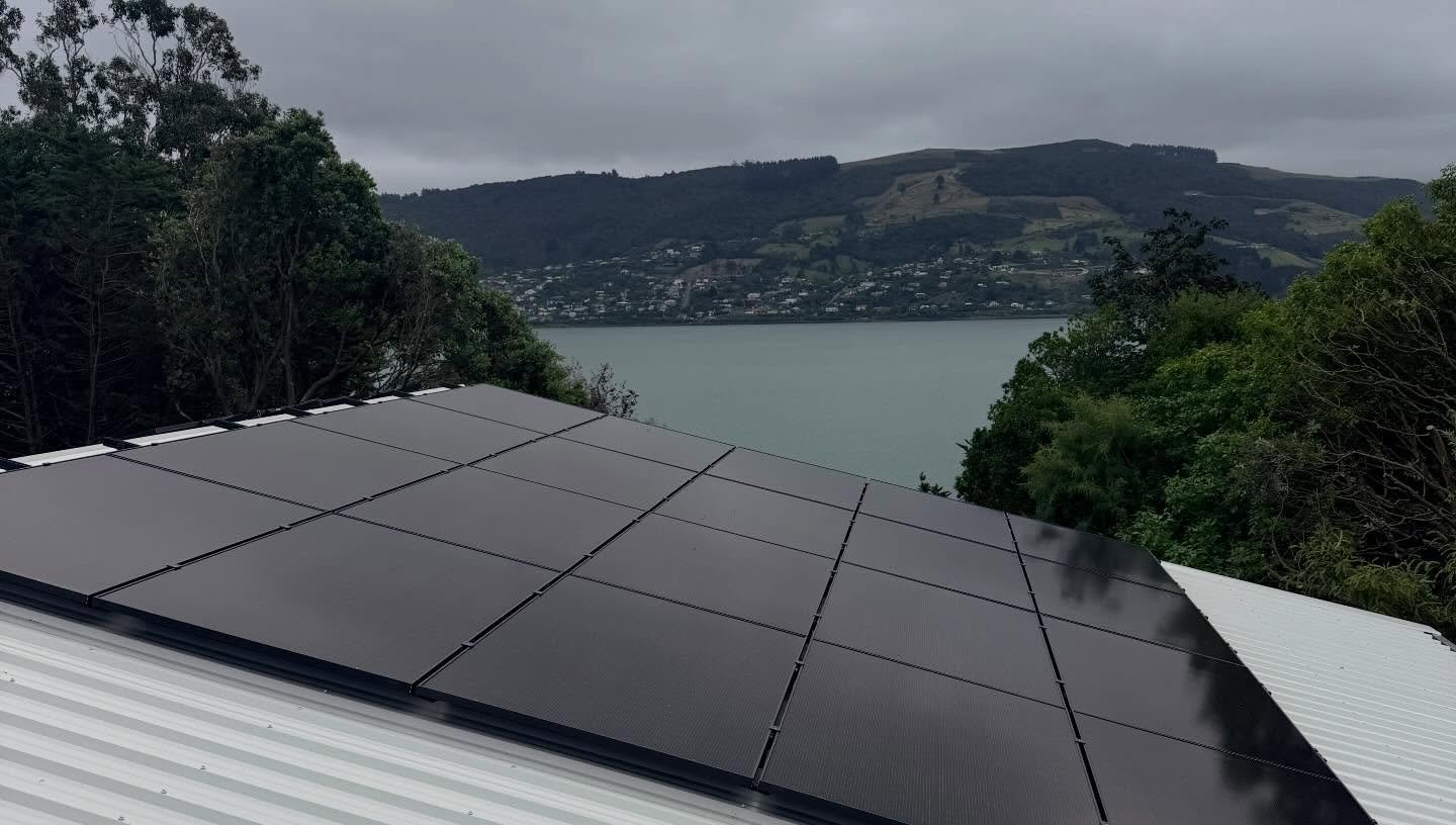 Finished Colorsteel Titania reroof with solar panels on a Macandrew Bay home overlooking Otago Harbour